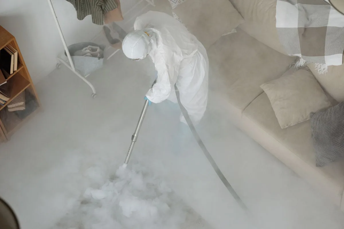 Biohazard cleanup technician in protective equipment, Bushnell, FL
